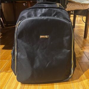 Elegant Black Backpack with Gold Details